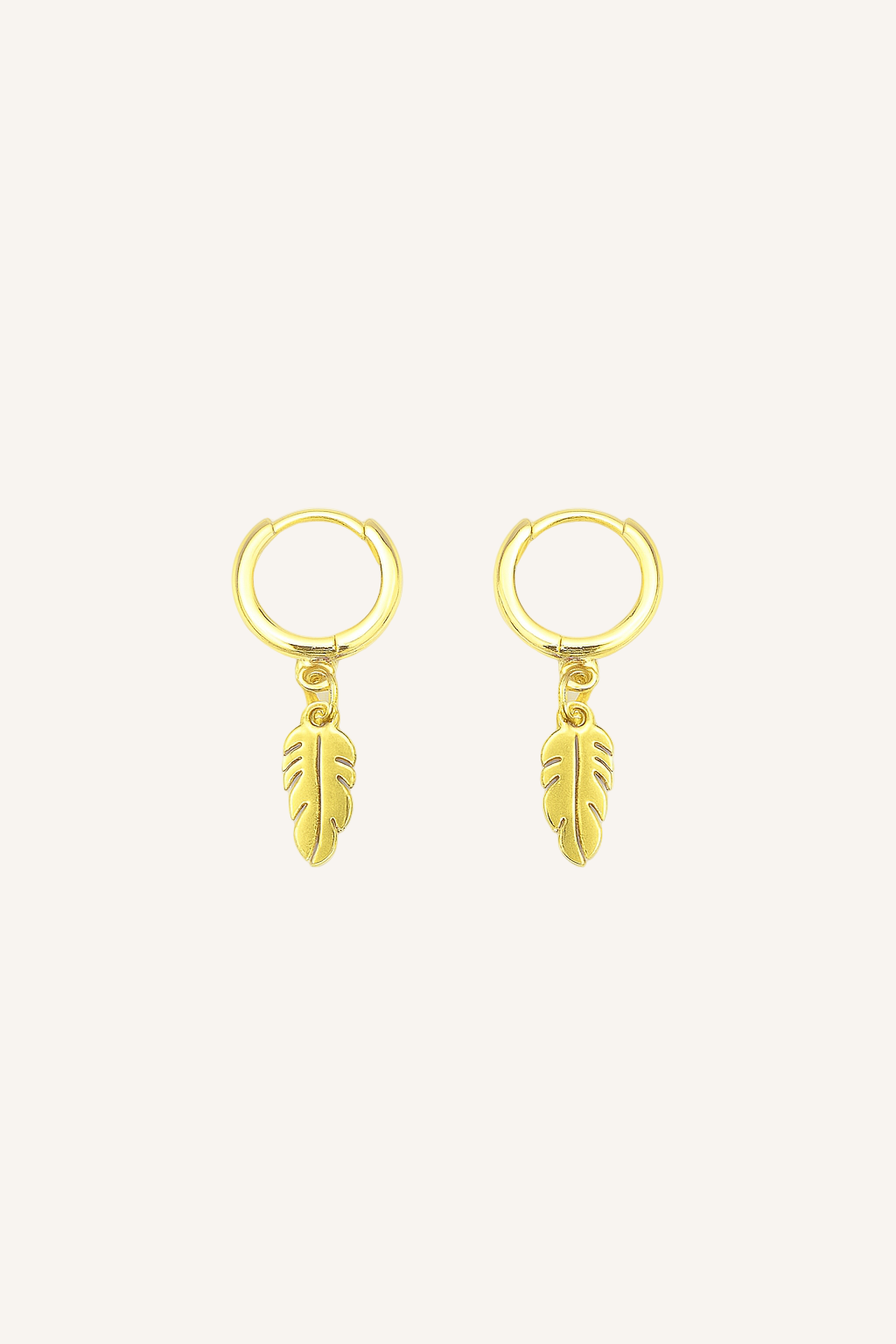 Gold hoop earrings with feather charms on a white background