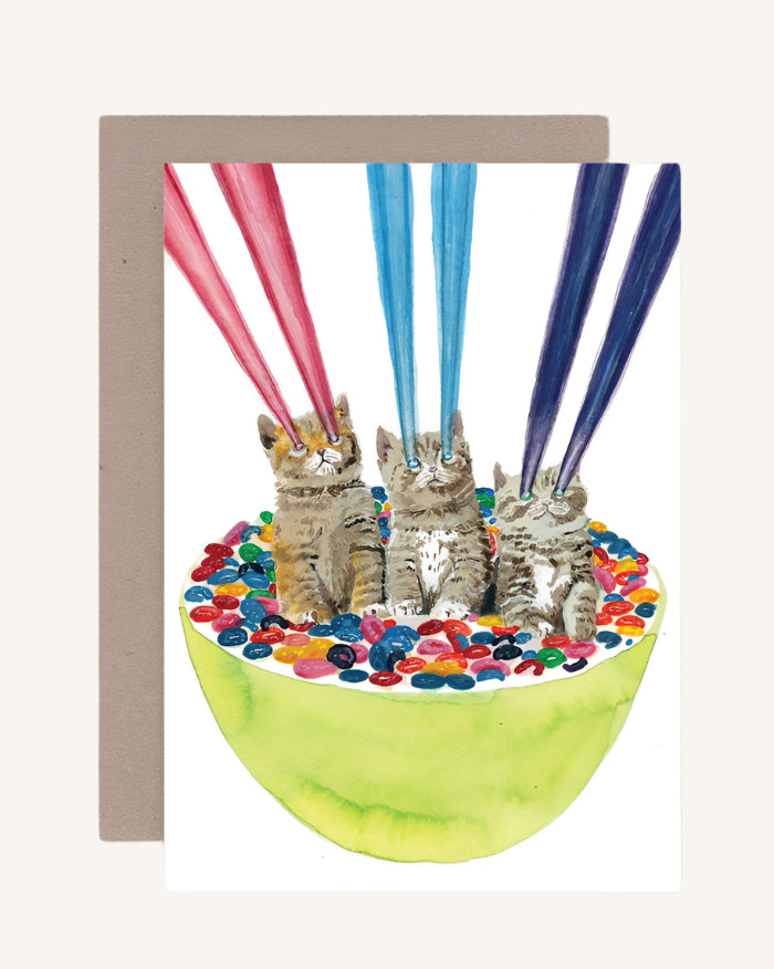 Card with kittens in a bowl of jelly beans and colorful straws on a gray background