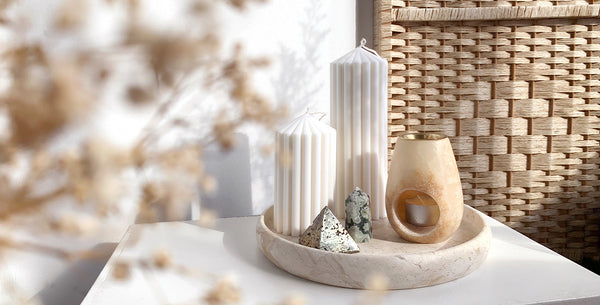 WYLD shop homewares: ribbed candles, crystals, onyx oil burner and marble tray