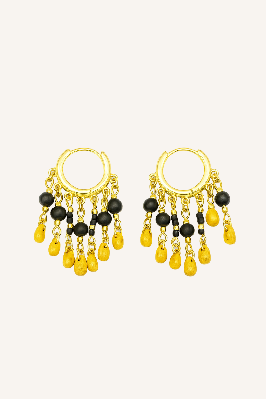 Pair of gold hoop earrings with black and yellow beads on a white background