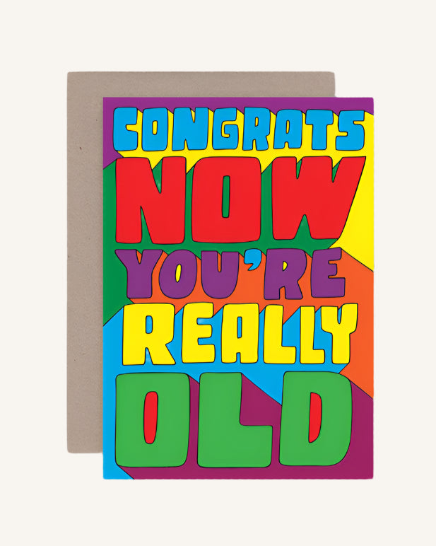 A colorful greeting card with the text 'CONGRATS NOW YOU'RE REALLY OLD' in bold, capital letters.