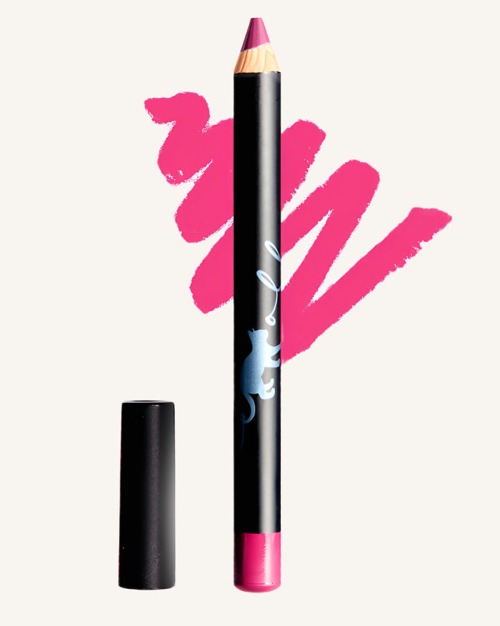 A pink Bluemolly lip crayon with its cap removed, shown alongside a swatch of the product demonstrating its color and texture.