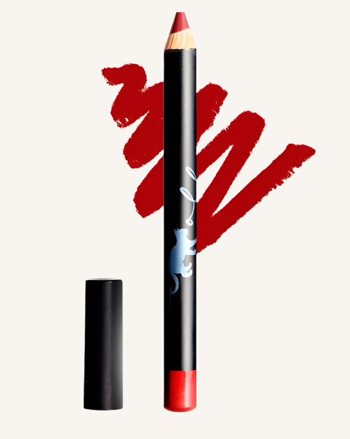 A red Bluemolly lip crayon with its cap removed, shown alongside a swatch of the product demonstrating its color and texture.