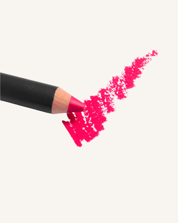 Black and pink makeup pencil with pink color swatch on a white background