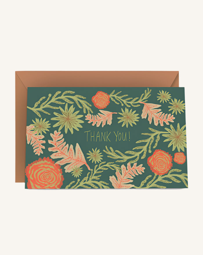 Floral patterned card with 'Thank you!' text on a green background, featuring a brown envelope.