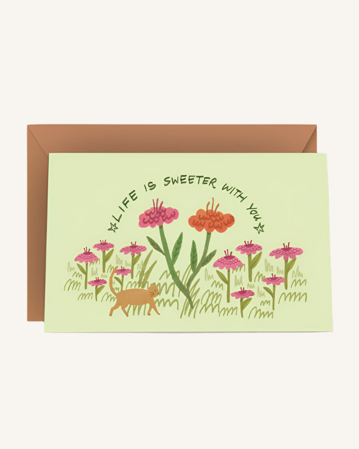 Greeting card with floral design and text on a light green background