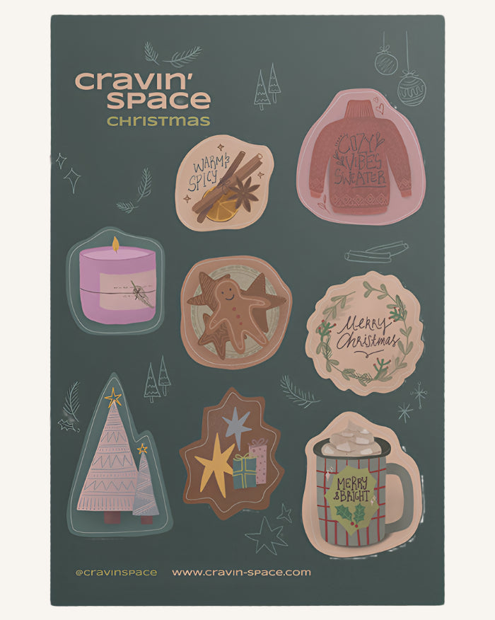 A Christmas-themed sticker sheet with various designs including gingerbread cookies, a candle, a sweater, presents, and a cup of cocoa, by Cravin' Space.